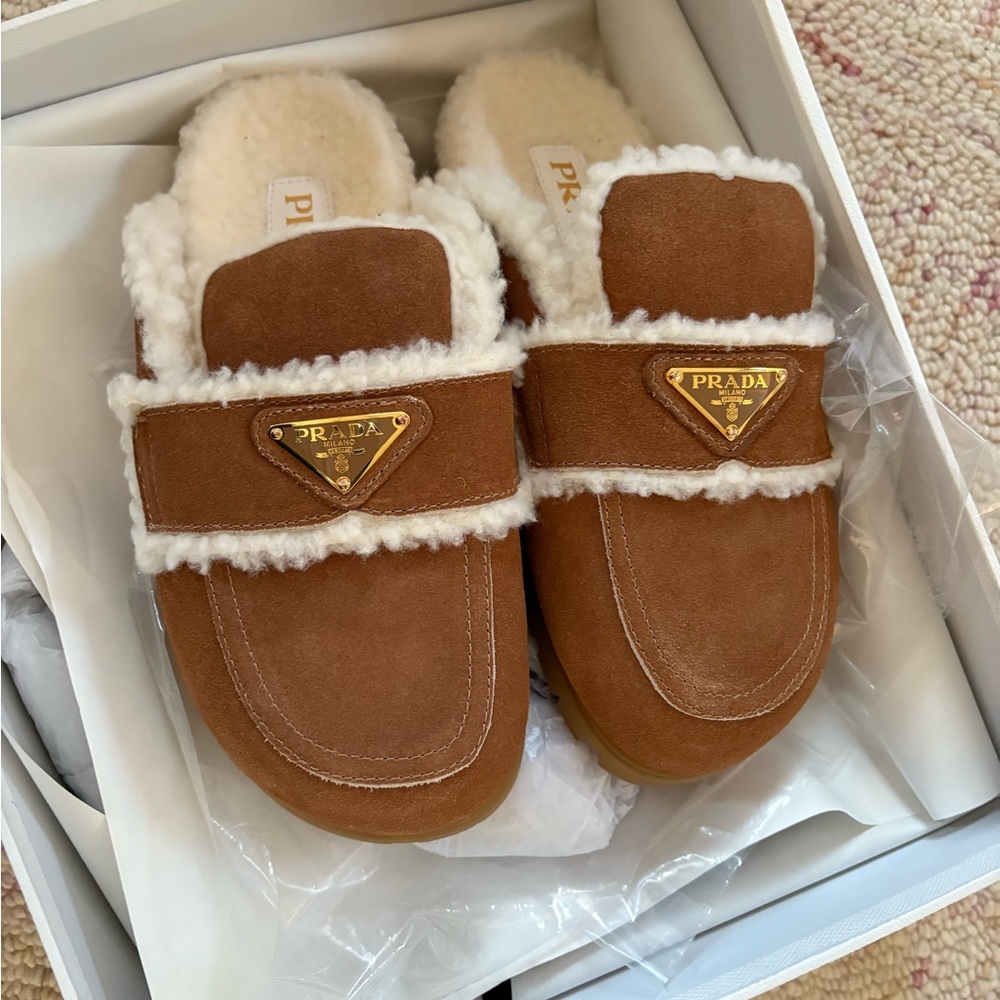 Prada Tan Shearling Mules with Gold Logo